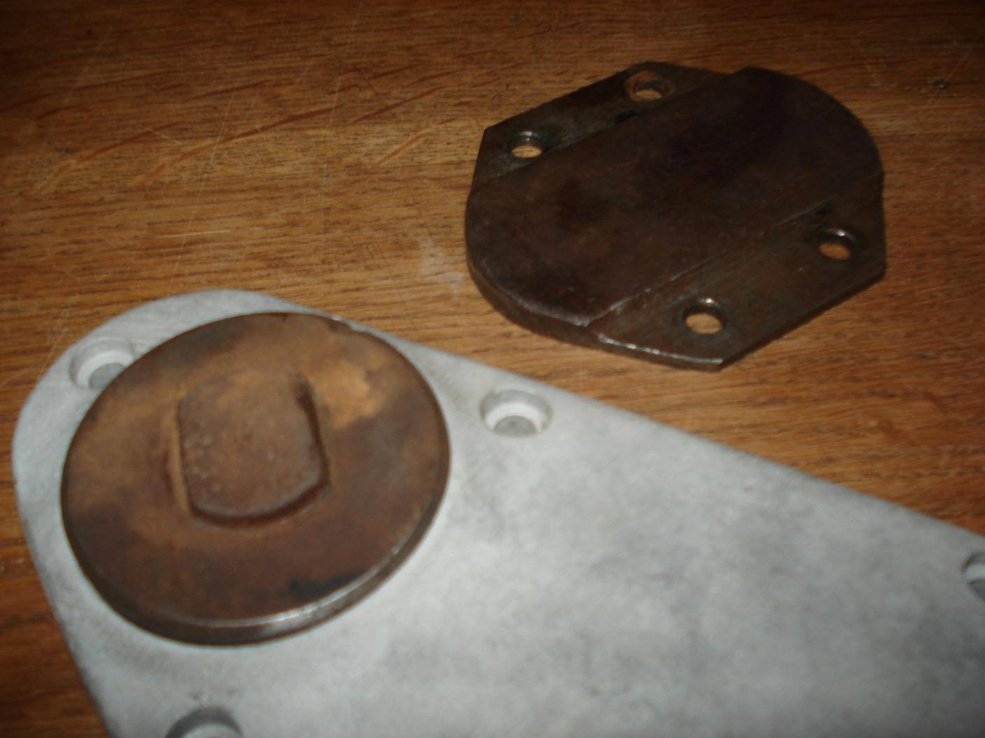 Non-standard steel timing plug fitted to the KM21 timing cover.