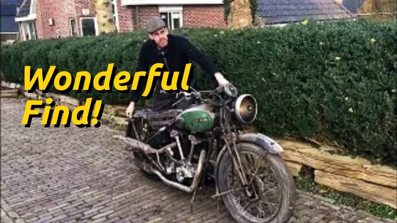 Owner moving a patinated BSA J11 V-twin barn find outdoors, with “Wonderful Find!” text.